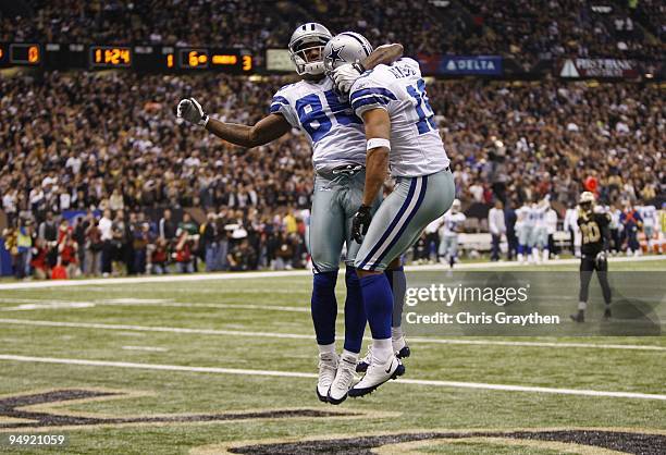 Miles Austin of the Dallas Cowboys reacts after his 49-yard touchdown with Kevin Ogletree in the first quarter against the New Orleans Saints at the...