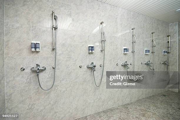 modern shower room with silver showers and dispensers - shower room stock pictures, royalty-free photos & images