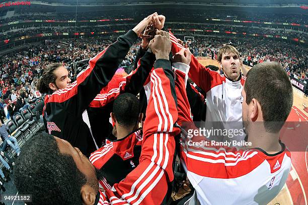 Joakim Noah and Aaron Gray of the Chicago Bulls get in the huddle with their teammates before the NBA game against the Atlanta Hawks on December 19,...