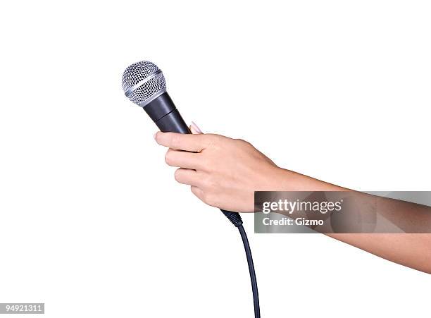 holding a microphone - hand microphone stock pictures, royalty-free photos & images