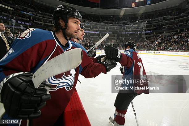 Darcy Tucker congratulates Chris Stewart of the Colorado Avalanche after his first period goal against the Columbus Blue Jackets at the Pepsi Center...