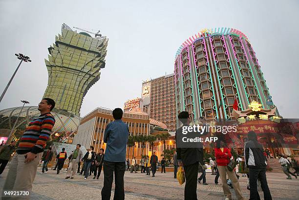 Macau-China-gaming-entertainment,FEATURE" by Peter Brieger Visiters pose for pictures and admire the area outside the new Grand Lisboa hotel and...