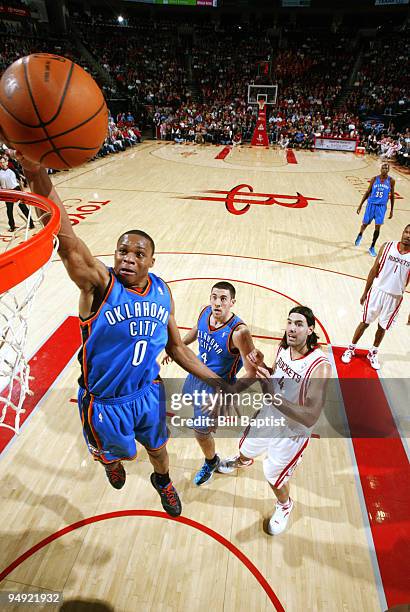 Russell Westbrook of the Oklahoma City Thunder shoots the ball over Luis Scola of the Houston Rockets on December 19, 2009 at the Toyota Center in...