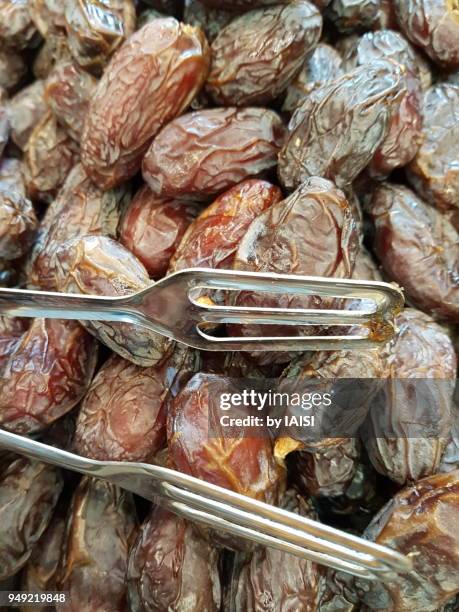 medjool dates from the jordan valley at the market - glenn fine stock pictures, royalty-free photos & images