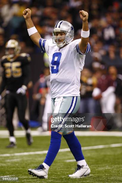 Quarterback Tony Romo of the Dallas Cowboys celebrates a touchdown in the second half against the New Orleans Saints at the Louisiana Superdome on...