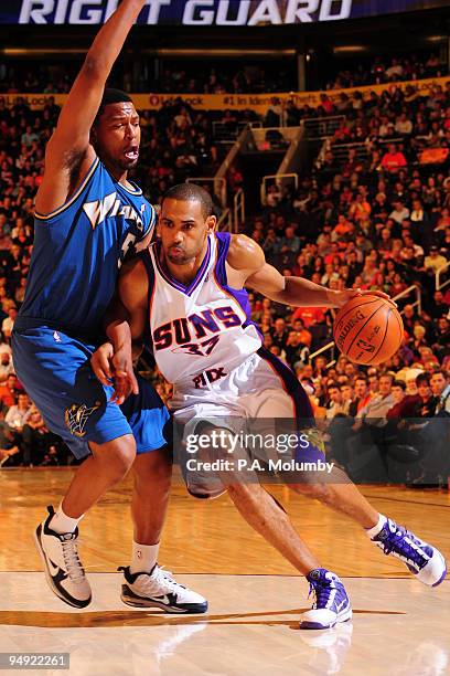 Grant Hill of the Phoenix Suns drives against Dominic McGuire of the Washington Wizards in an NBA Game played on December 19, 2009 at U.S. Airways...