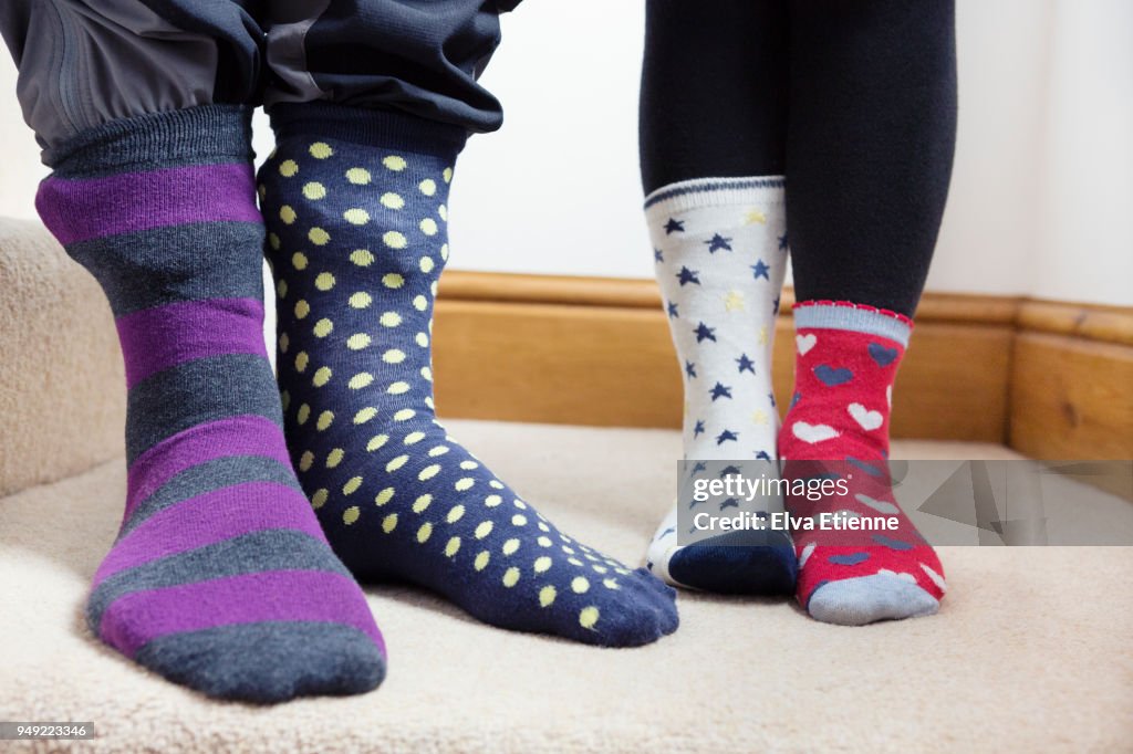 Two children wearing odd socks