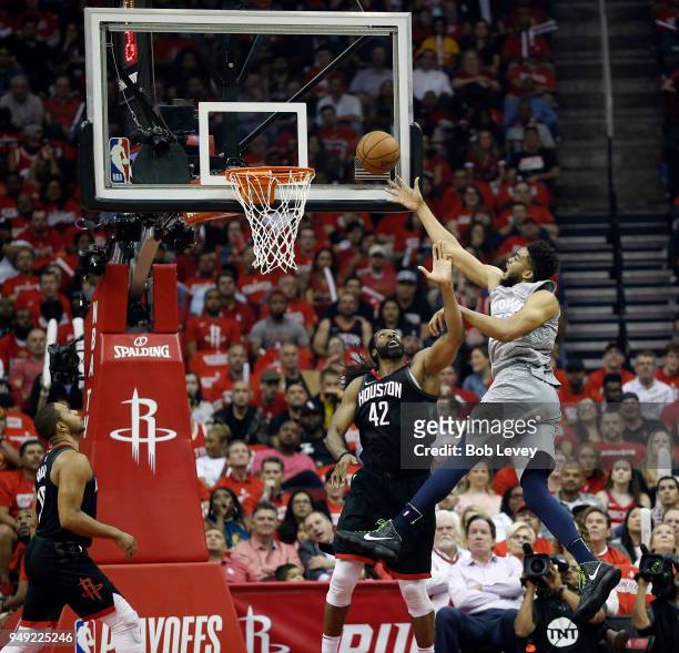 Karl-Anthony Towns of the Minnesota Timberwolves puts up a shot over Nene of the Houston Rockets during Game Two of the first round of the Western...