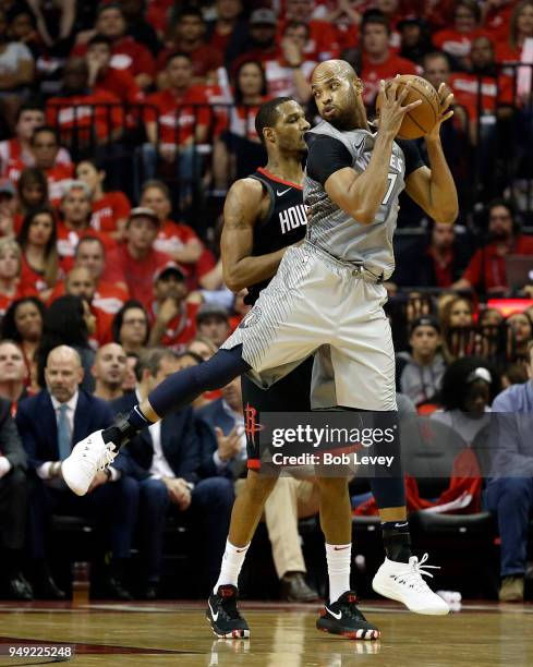 Taj Gibson of the Minnesota Timberwolves grabs the ball in front of Trevor Ariza of the Houston Rockets during Game Two of the first round of the...