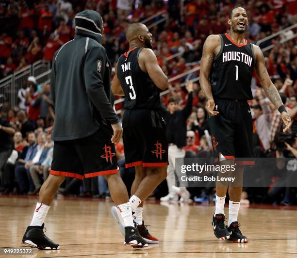 Trevor Ariza of the Houston Rockets reacts with Chris Paul after making a three point shot against the Minnesota Timberwolves during Game Two of the...