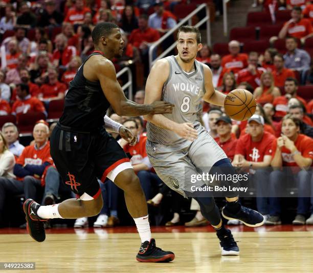 Nemanja Bjelica of the Minnesota Timberwolves drives around Joe Johnson of the Houston Rockets during Game Two of the first round of the Western...