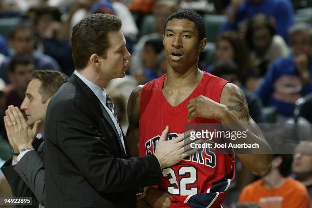 Head coach Chris Mooney talks to Justin Harper of the Richmond Spiders during the game against the Florida Gators on December 19, 2009 at the...