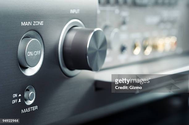 electronic controls to power device on and off - home theater stock pictures, royalty-free photos & images