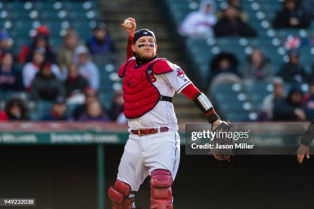 Catcher Roberto Perez of the Cleveland Indians throws out Mike Moustakas of the Kansas City Royals to end the top of the sixth inning at Progressive...