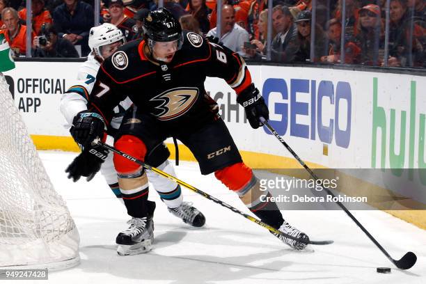 Rickard Rakell of the Anaheim Ducks controls the puck with pressure from Paul Martin of the San Jose Sharks in Game Two of the Western Conference...