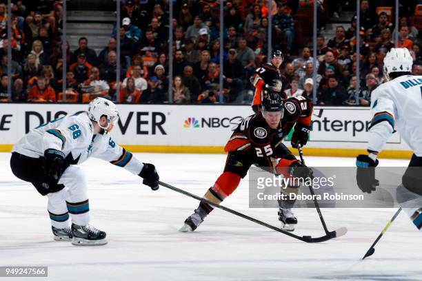 Ondrej Kase of the Anaheim Ducks skates with the puck against Melker Karlsson and Brenden Dillon of the San Jose Sharks in Game Two of the Western...