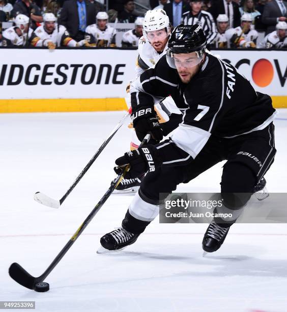 Oscar Fantenberg of the Los Angeles Kings skates with the puck with pressure from James Neal of the Vegas Golden Knights in Game Four of the Western...