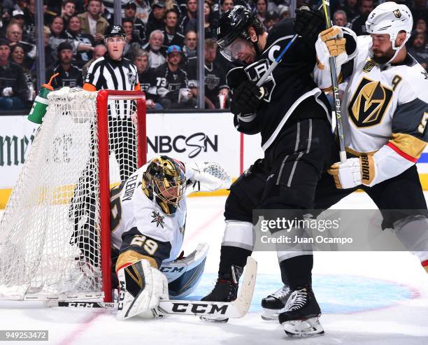 Anze Kopitar of the Los Angeles Kings battles for the puck in front of the net against Deryk Engelland and Marc-Andre Fleury of the Vegas Golden...