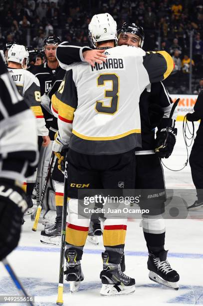 Drew Doughty of the Los Angeles Kings hugs Brayden McNabb of the Vegas Golden Knights following Game Four of the Western Conference First Round...