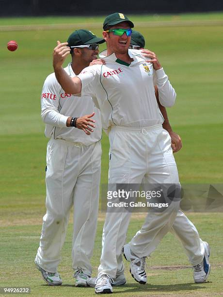 Graeme Smith of South Africa celebrates his catch to dismiss Alastair Cook of England for 12 runs during day 5 of the 1st Test match between South...