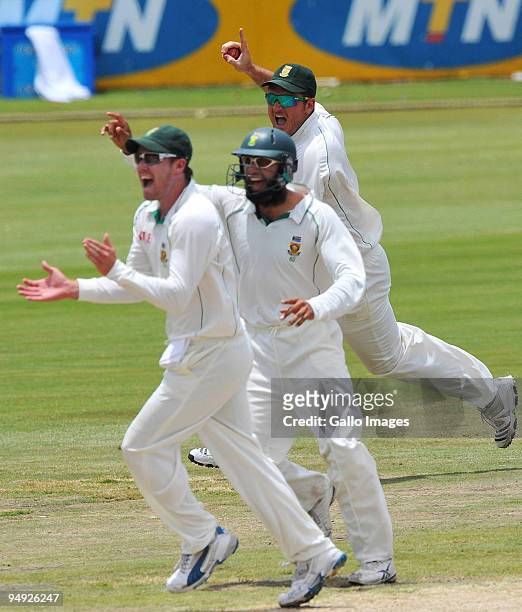 Proteas celebrate the wicket of Alastair Cook of England for 12 runs during day 5 of the 1st Test match between South Africa and England from...