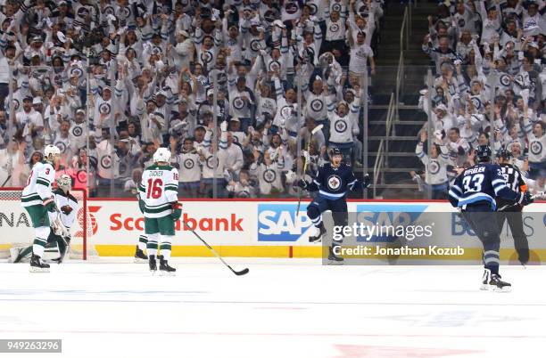 Joel Armia of the Winnipeg Jets celebrates after scoring a first period goal against the Minnesota Wild in Game Five of the Western Conference First...