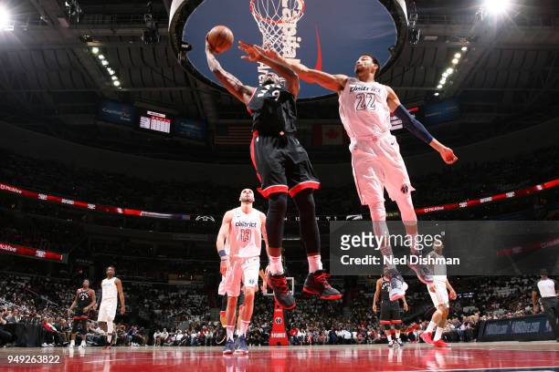 Serge Ibaka of the Toronto Raptors shoots the ball against Otto Porter Jr. #22 of the Washington Wizards in Game Three of Round One of the 2018 NBA...