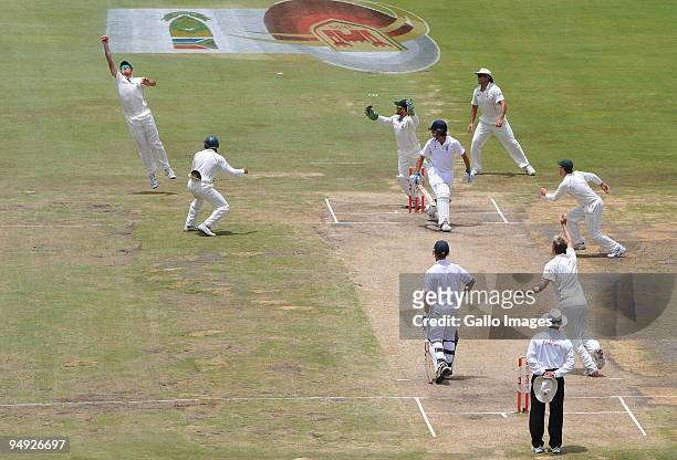Graeme Smith of South Africa takes the catch to dismiss Alastair Cook of England for 12 runs off the bowling of Paul Harris of South Africa during...