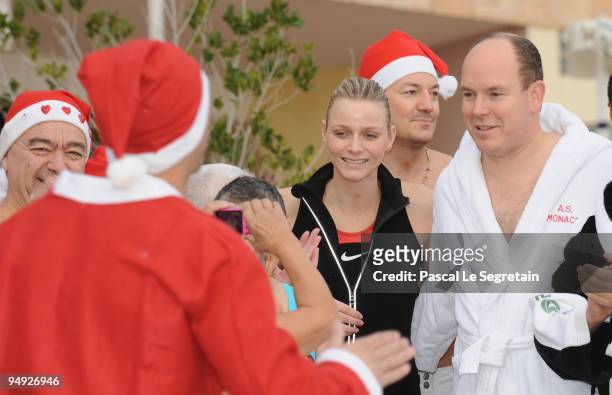 Prince Albert II of Monaco and Charlene Wittstock attend the Annual Charity Christmas Swim for TATSA Association on December 20, 2009 in Monaco,...