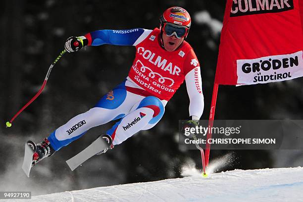 Swiss Didier Cuche competes to take the tenth place of the men's World Cup downhill race in Val Gardena on December 19, 2009. Canada's Manuel...