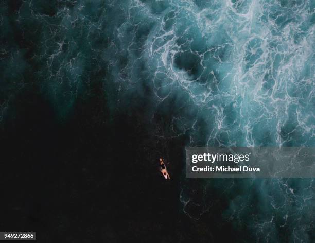 aerial view of surfer surfing waves - pacific fotografías e imágenes de stock