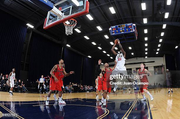 Amara Sy of the Bakersfield Jam goes to the basket against Mildon Ambres, Sundiata Gaines and Mike Gansey of the Idaho Stampede during a D-League...