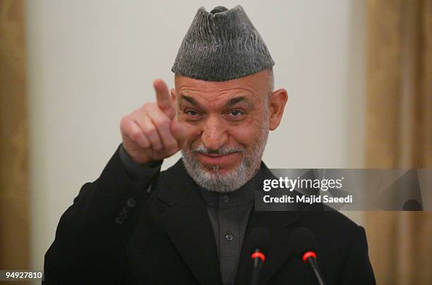 Afghanistan's President Hamid Karzai attends a joint press conference with Belgian Prime Minister Yves Leterme on December 20, 2009 in Kabul,...