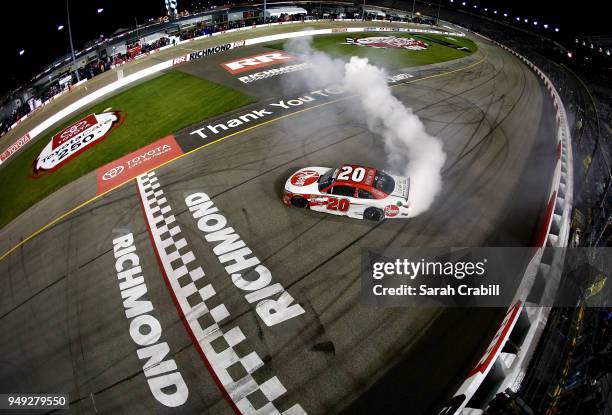 Christopher Bell, driver of the Rheem Toyota, celebrates with a burnout after winning the NASCAR Xfinity Series ToyotaCare 250 at Richmond Raceway on...