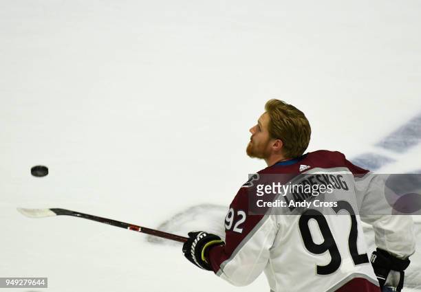 Colorado Avalanche left wing Gabriel Landeskog throws and balances the puck on bis stick during warm-ups before playing the Nashville Predators for...
