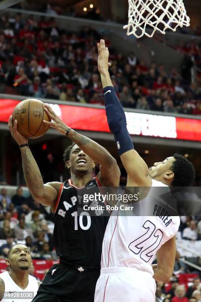 DeMar DeRozan of the Toronto Raptors puts up a shot in front of Otto Porter Jr. #22 of the Washington Wizards in the first half during Game Three of...