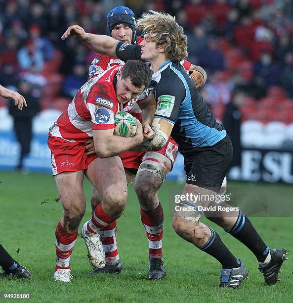 Tim Molenaar of Gloucester is tackled by Richie Grey during the Heineken Cup match between Gloucester and Glasgow Warriors at Kingsholm on December...