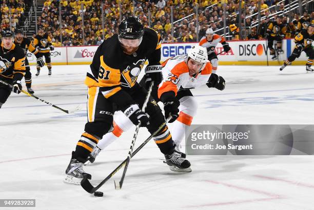Phil Kessel of the Pittsburgh Penguins moves the puck past the defense fo Brandon Manning of the Philadelphia Flyers in Game Five of the Eastern...