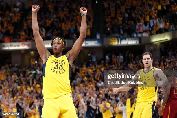 Myles Turner and Bojan Bogdanovic of the Indiana Pacers celebrate at the end of game three of the NBA Playoffs against the Cleveland Cavaliers at...