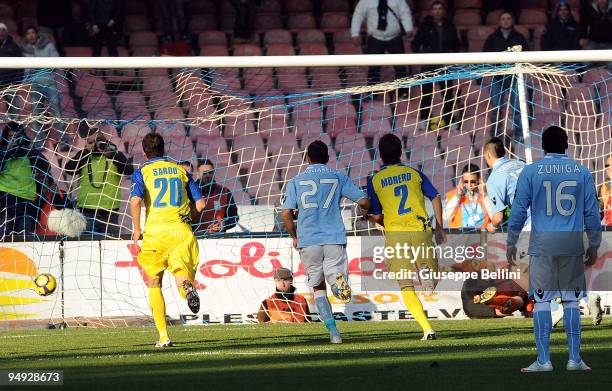 Goalkeeper Stefano Sorrentino of Chievo fails to stop Marek Hamsik of SSC Napoli scoring the opening goal from a penalty during the Serie A match...