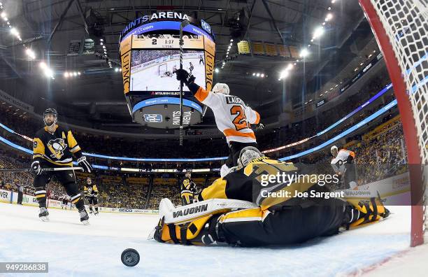 Scott Laughton of the Philadelphia Flyers celebrates the game winning goal by Sean Couturier of the Philadelphia Flyers against Matt Murray of the...