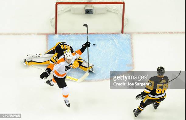 Scott Laughton of the Philadelphia Flyers celebrates the game winning goal by Sean Couturier of the Philadelphia Flyers against Matt Murray of the...