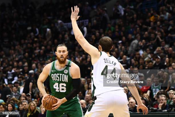 Aron Baynes of the Boston Celtics is defended by Tyler Zeller of the Milwaukee Bucks during the first half of game three of round one of the Eastern...