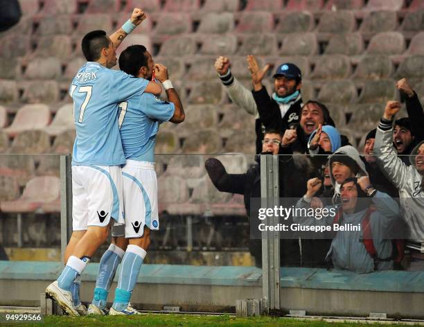 Fabio Quagliarella of Napoli celebrates his 2:0 goal with fans, joined by teammate Marek Hamsik during the Serie A match between Napoli and Chievo at...