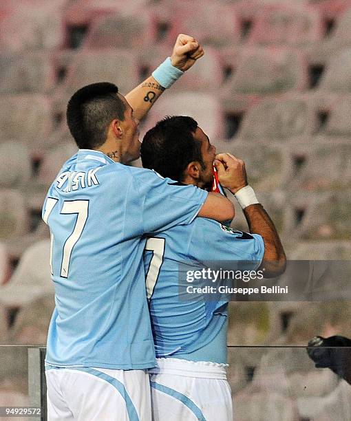 Fabio Quagliarella of Napoli celebrates his 2:0 goal in front of fans, joined by teammate Marek Hamsik during the Serie A match between Napoli and...