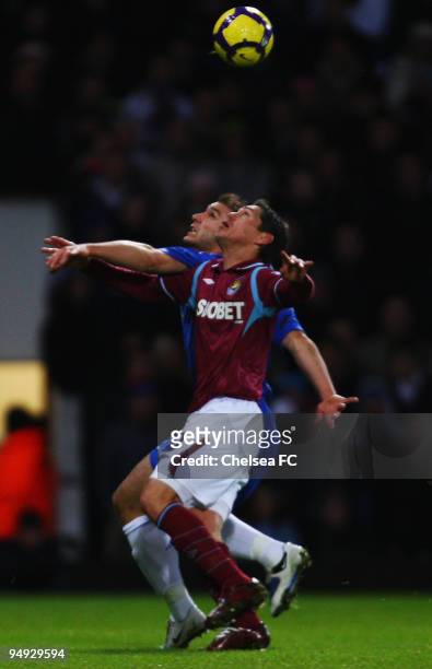 Branislav Ivanovic of Chelsea and Guillermo Franco of West Ham United challenge for the ball during the Barclays Premier League match between West...