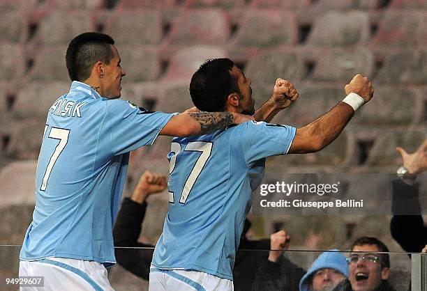 Fabio Quagliarella of Napoli celebrates his 2:0 goal with fans, joined by teammate Marek Hamsik during the Serie A match between Napoli and Chievo at...