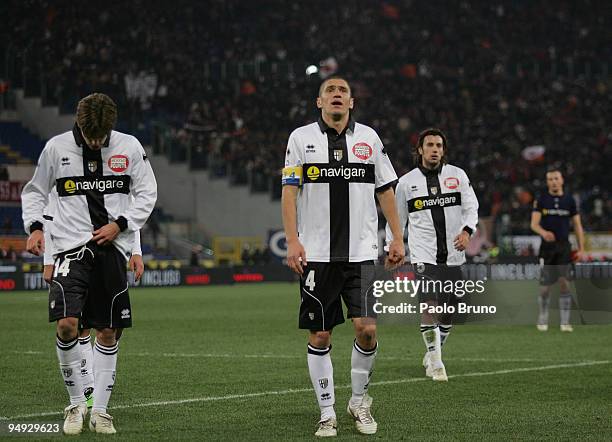 Daniele Galloppa , Stefano Morrone ,and Cristian Zaccardo of Parma FC show their dejection after the Serie A match between Roma and Parma at Stadio...
