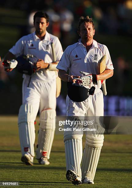 Paul Colliingwood and Graham Onions of England walk off following England's draw with South Africa during day five of the first test match between...