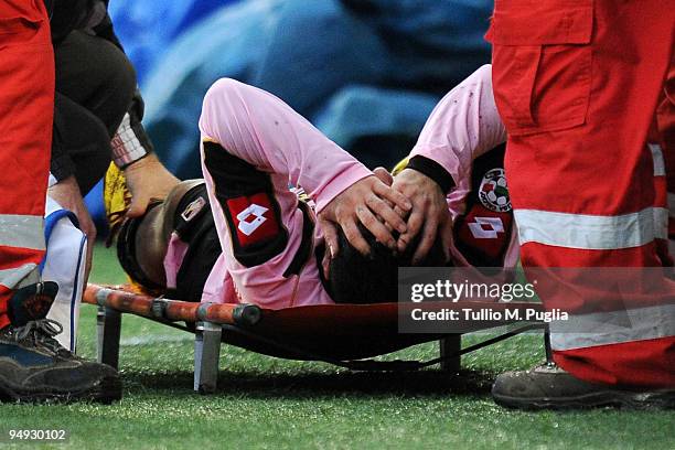 Fabrizio Miccoli of Palermo lies on a stretcher after sustaining an injury during the Serie A match between US Citta di Palermo and AC Siena at...